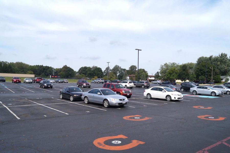 The parking lot doesn't have a lot of cars in it.