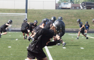 Braeden McGrady playing varsity football.