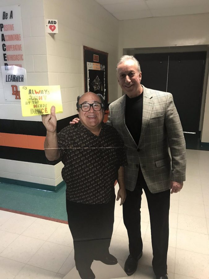 Dr.Stranges posing with cardboard cutout of Danny DeVito