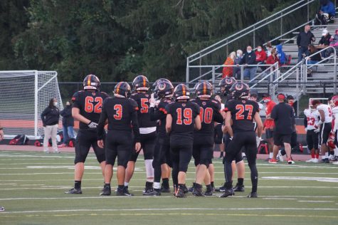 Hayes varsity football team huddles together