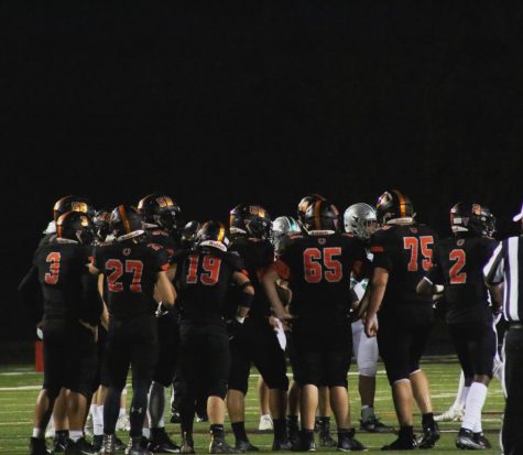 Hayes varsity football team standing on the field. 