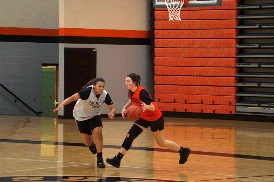 Junior Sophia Nice moves the ball down the court

