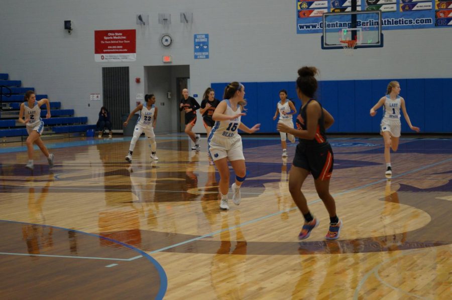 Hayes basketball player runs down the court.