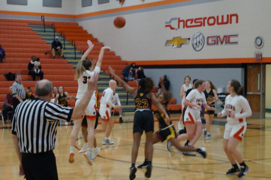 Lady Pacer shoots a three point shot. 