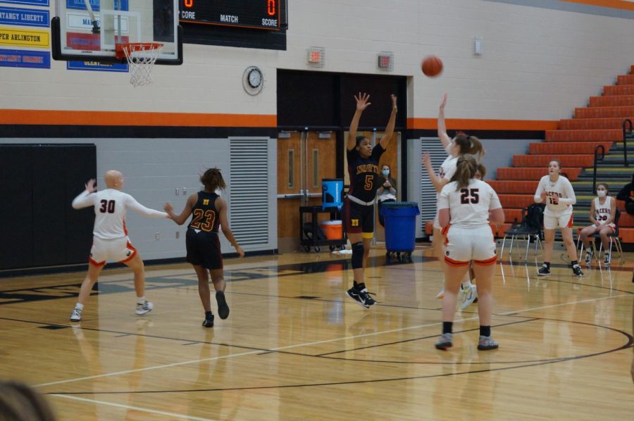 Lady Pacer makes a jump shot.