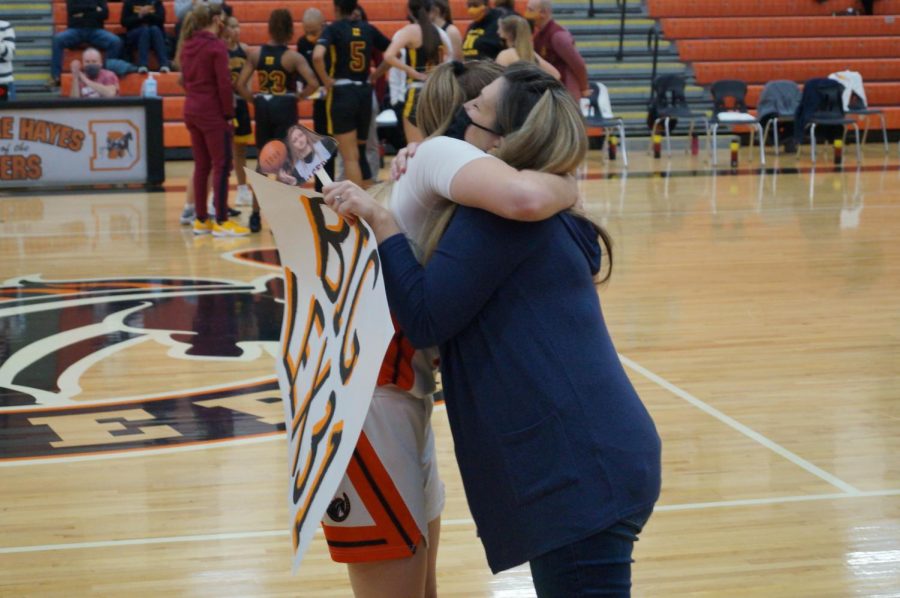 Lady Pacer hugs mom.