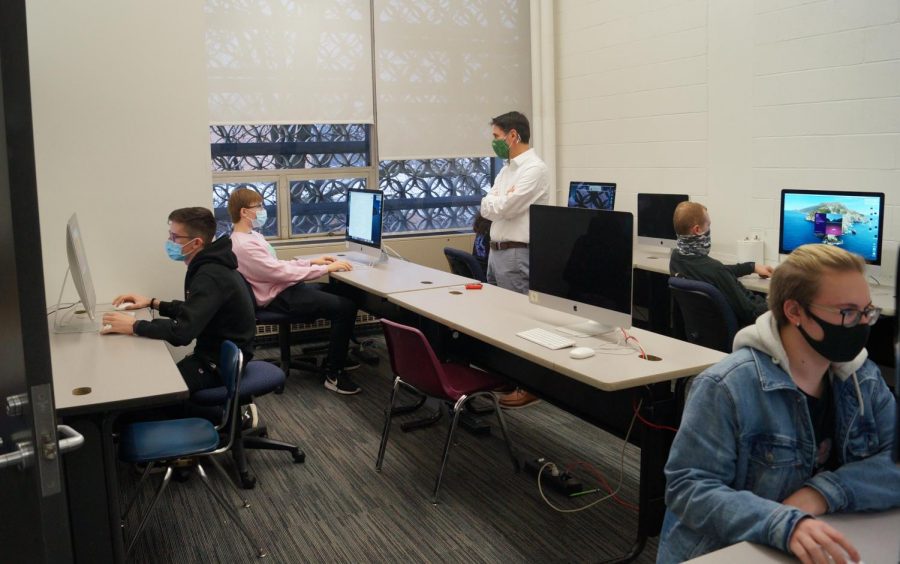 Members of Hayes Cinematics work on individual projects in the video production computer lab.  Covid-19 restrictions have prevented students from collaborating in groups like they have in previous years.