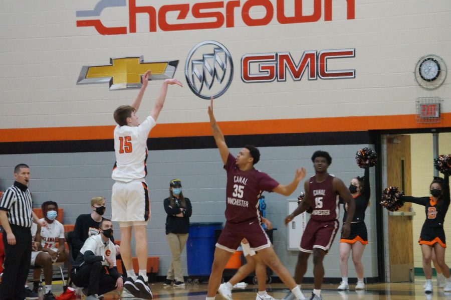 Hayes basketball player takes a 3 point shot.