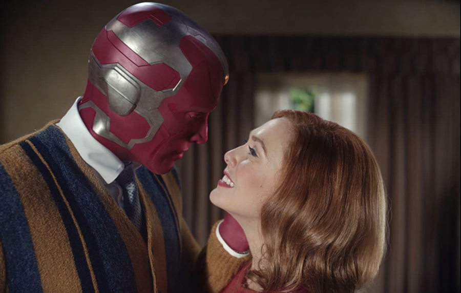 Wanda (Elizabeth Olsen) and Vision (Paul Bettany) share a moment in their new home. WandaVision is now available to stream on Disney+.