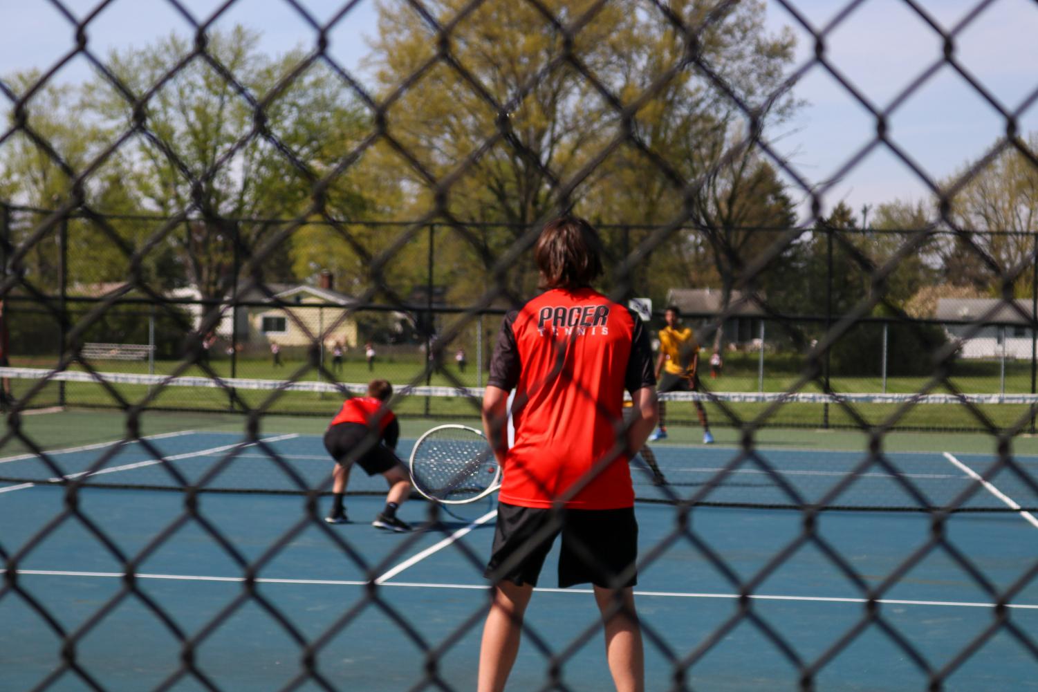 Grant LaMar and Ryne Higgins wait for their opponents to serve.