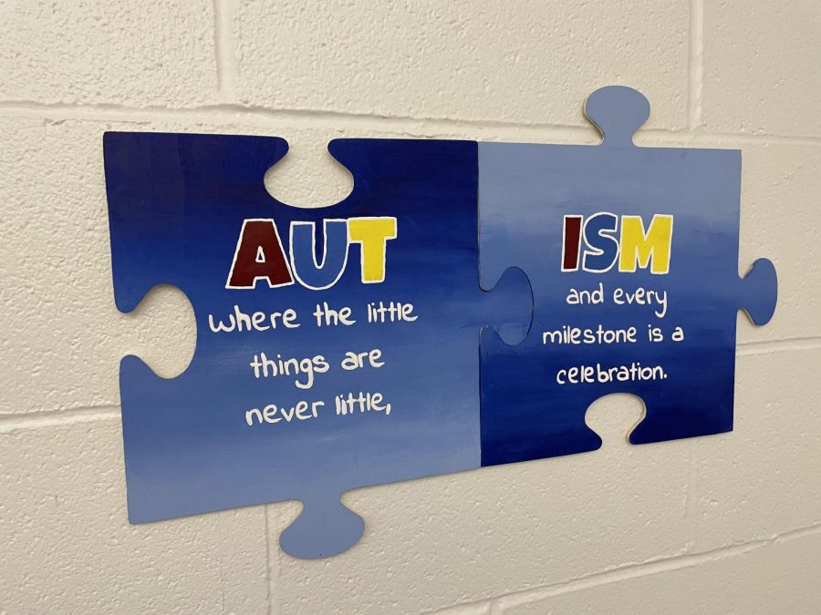 Puzzle pieces hang in the transition room promoting Autism awareness.