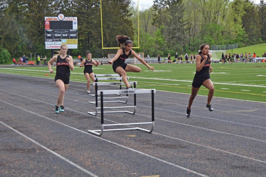 Freshman Abrianna Hite clears the hurdle.