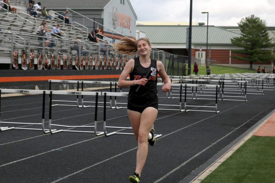 Junior Miranda Gemberling on the last stretch of the 4x800 relay.