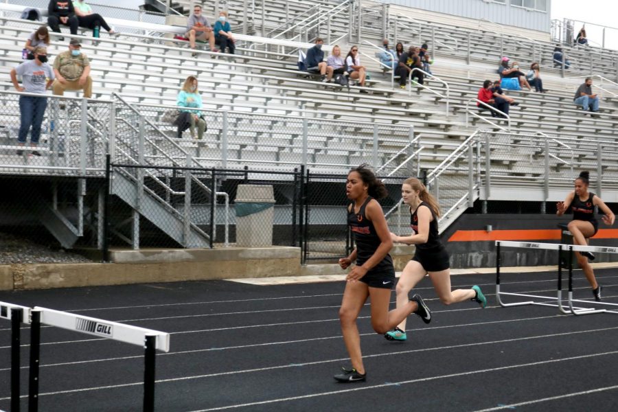 Three athletes running