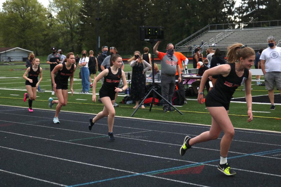 Four student athletes right as they leave start line