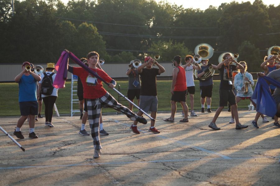 Freshman Ben Egbert practicing for color guard.