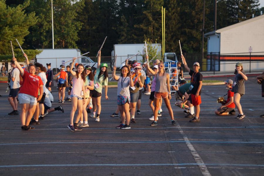 Flutes enjoying their brief intermission after running through part of their performance.