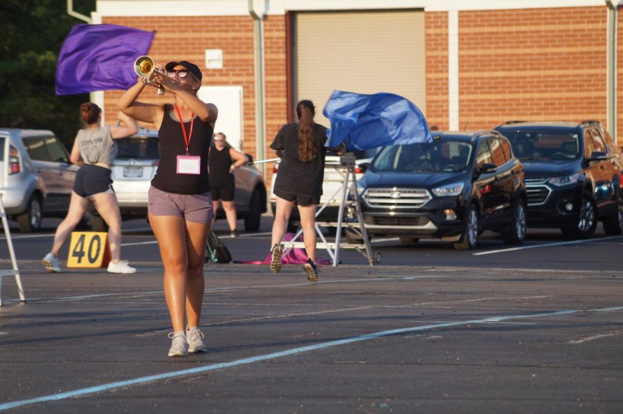 Senior Maddie Bricker playing trumpet.