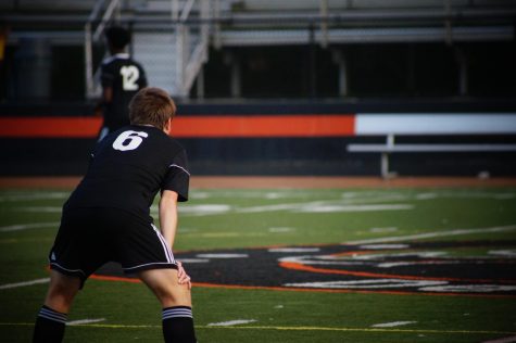 Boy crouching