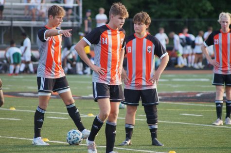 Boys standing with ball