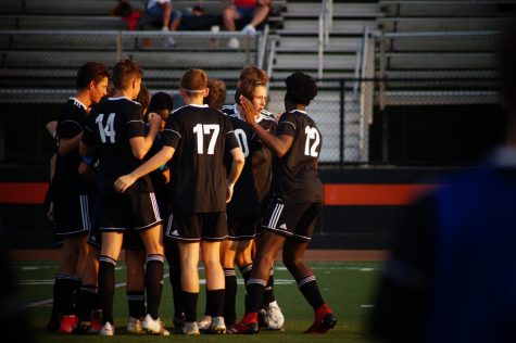 Boys huddling