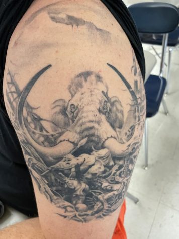 Physical Education teacher Phill Carr has a art tattoo on his upper arm.