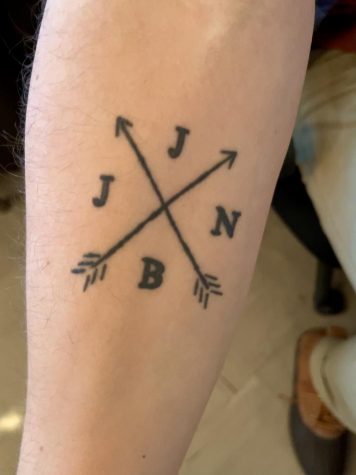 Math teacher Josh Hill has a siblings tattoo on his forearm. 