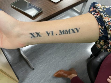 Intervention Specialist Amy Smock got a Roman numeral tattoo on her forearm.