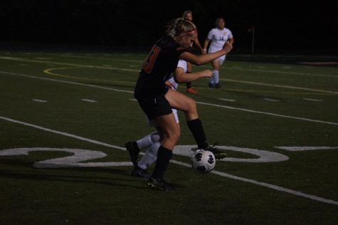 girl playing soccer