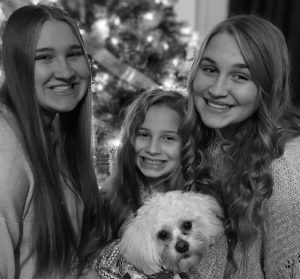 Sophomore Lainie Rafey and her sisters on Christmas morning.