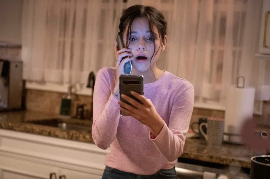 Tara (Jenna Ortega) reacts in horror as she receives a phone call from serial killer Ghostface in "Scream (2022)." The film is now playing in theaters.