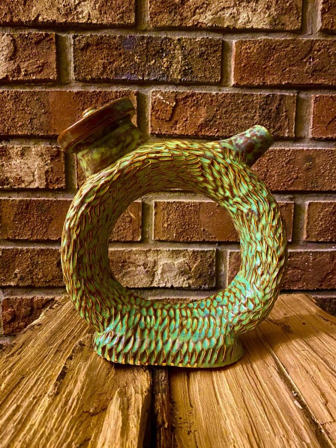A donut teapot done by Lonny Curry.