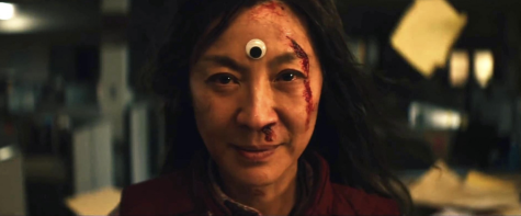 Evelyn Wang (Michelle Yeoh) faces down the multiverse in Everything Everywhere All at Once. The film is now playing in theaters.
