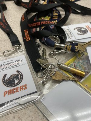 A pile of Delaware City Schools lanyards sit on a table. Lanyards are now required at all times for students and staff at Hayes High School.