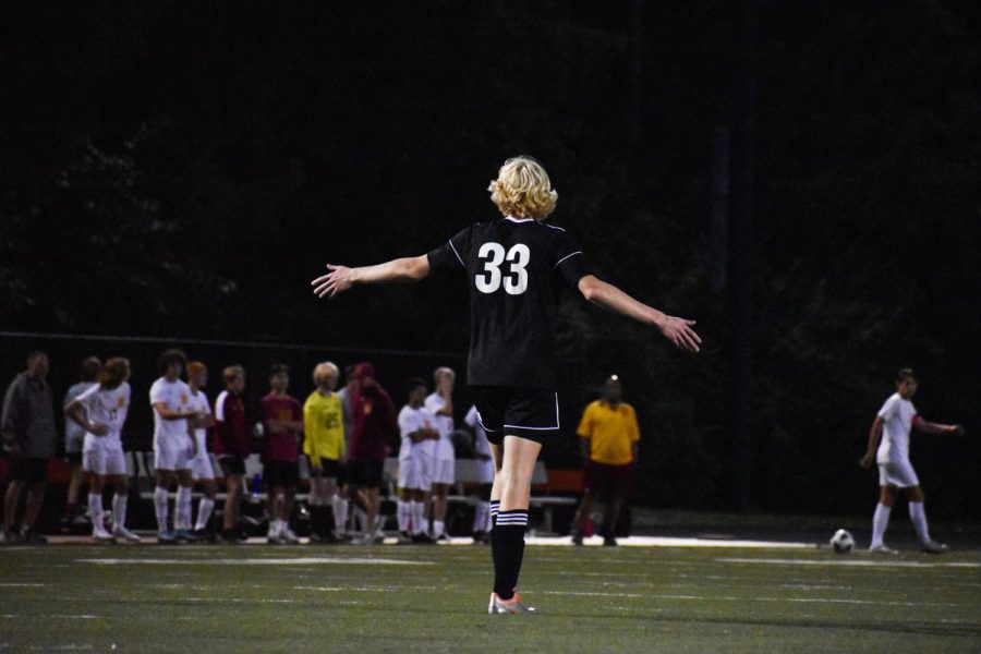Junior Will Polter signals the defense during the Westerville North soccer game.