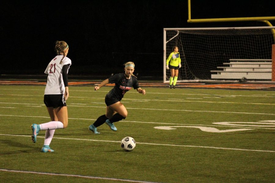 Blair runs to defend the ball during the Oct. 4 soccer game.