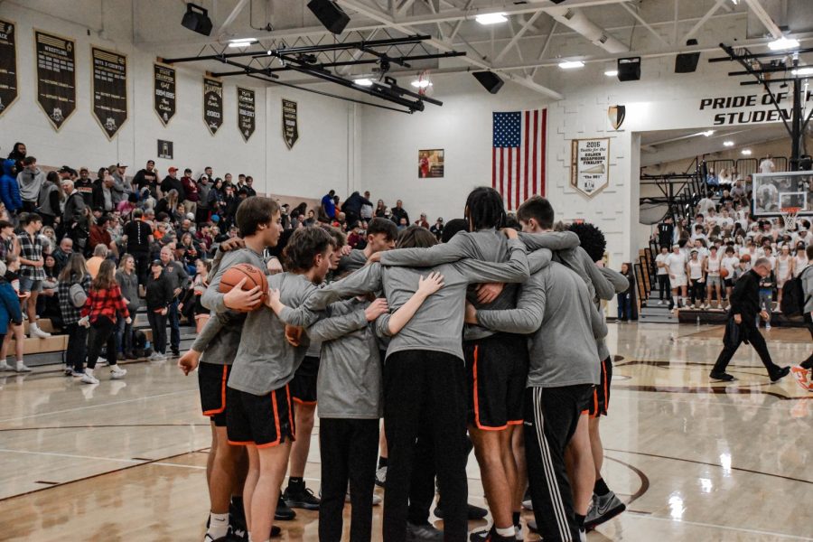 The Hayes basketball team circles up prior to the rivalry game against BV on November 23.