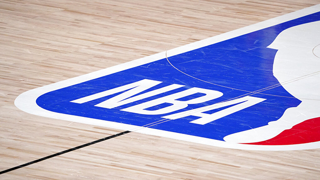 The NBA logo at center court is shown during the second half of an NBA first-round playoff basketball game between the Houston Rockets and Oklahoma City Thunder in Lake Buena Vista, Fla., Wednesday, Sept. 2, 2020. (AP Photo/Mark J. Terrill)