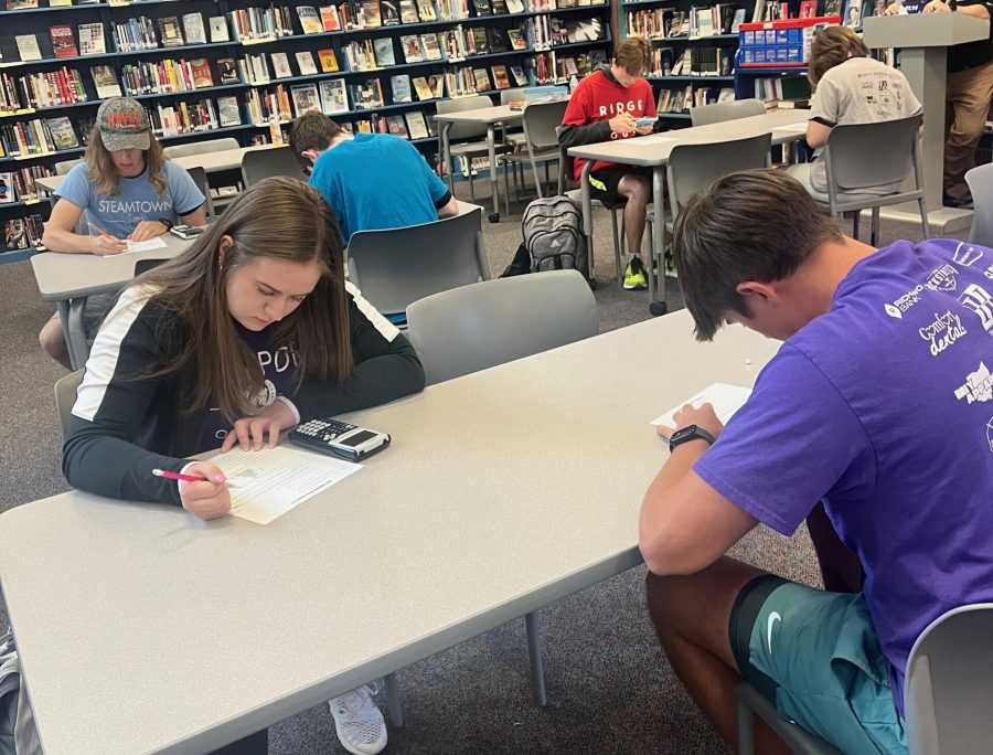 Seniors Morgan Connar and Carson Bay compete in the fourth round of the 2023 Math Madness competition.  Bay won the competition for Hayes this year.