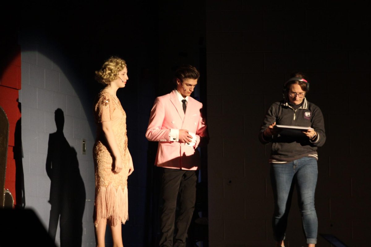 Director Kelsey Wright preps scene with actors for The Great Gatsby, which will be performed this weekend.