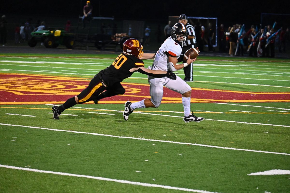 Senior Gavin Brinkmoeller catches a pass and looks to turn upfield. 