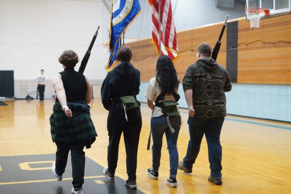 AFJROTC cadets Nathan LaPat, Angelys Gonzalez-Rieatra, Mark Cochran and Emma Kranhouse practice drill routines in the aux gym. The program is starting new recruiting initiatives in order to avoid shutdown.