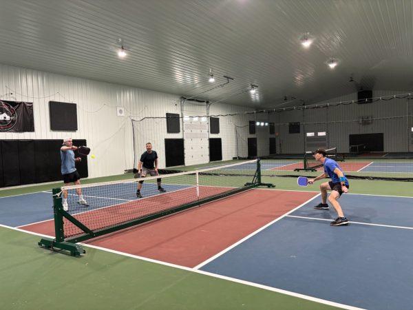 Members of a local pickleball league play at the Paddle Barn in Delaware.