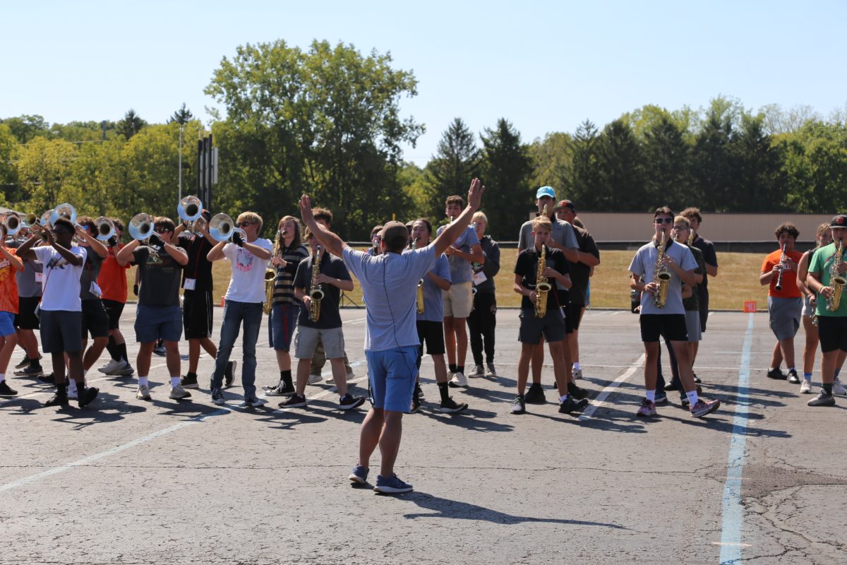 Band Director Bill Fowles instructing the Grand Pacer marching band.