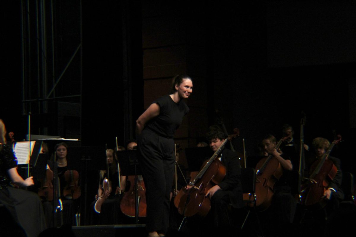 Selley is introduced to conduct the concert. 