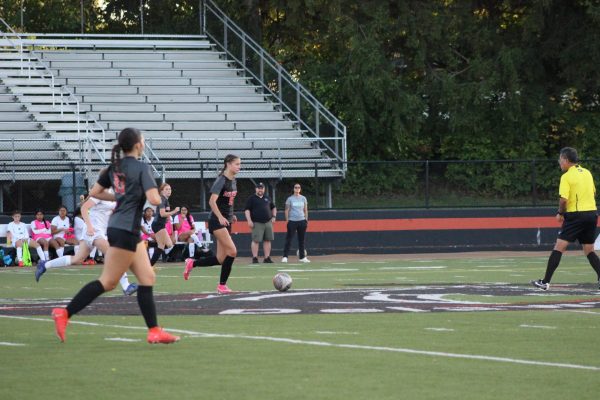 Senior Ally Dudley moves up eld to pass during an LPS game against Westland.