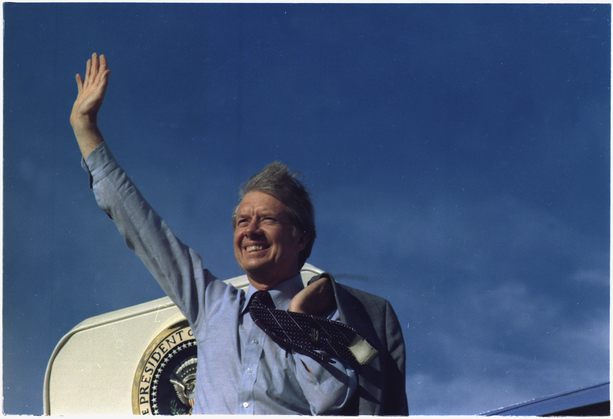 Jimmy Carter waves from the steps of Air Force One. Carter is the longest living US President, now celebrating his 100th Birthday.