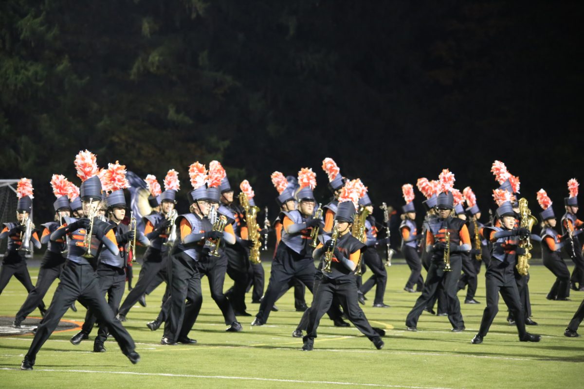 The Grand Pacer Marching Band plays their "Girl in Red" show for their home crowd.