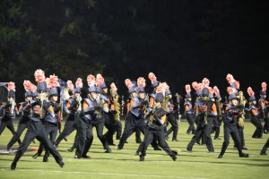 The Grand Pacer Marching Band plays their "Girl in Red" show for their home crowd.
