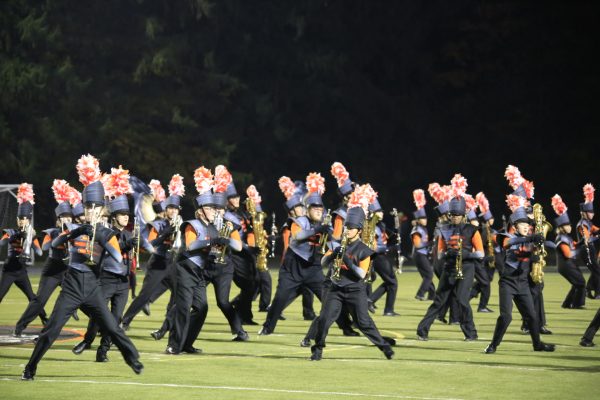 The Grand Pacer Marching Band plays their "Girl in Red" show for their home crowd.